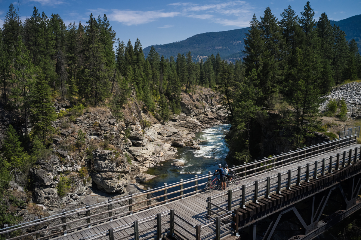 Biking on a trestle bridge on the Kettle Valley Trail in Christina Lake